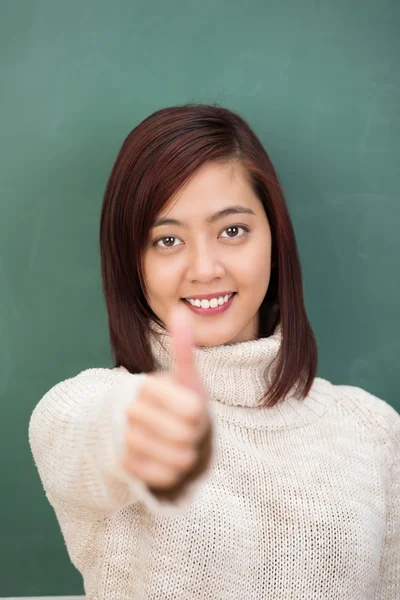 Student giving a thumbs up gesture — Stock Photo, Image