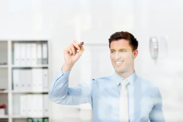 Businessman writing on a virtual interface — Stock Photo, Image