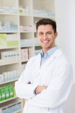 Confident friendly male pharmacist clipart