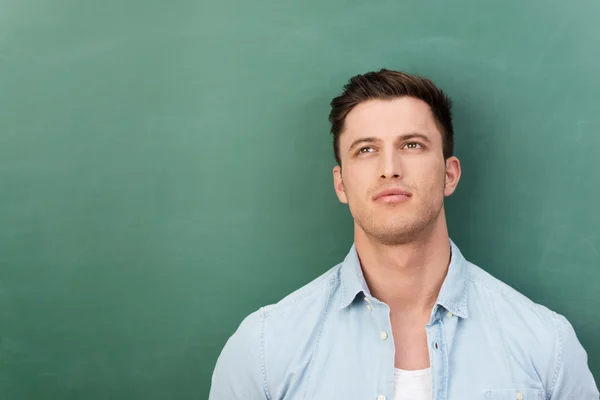 Pensive young man in a deep reverie — Stock Photo, Image