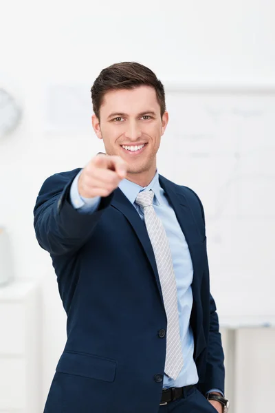 Handsome young businessman pointing at the camera — Stock Photo, Image