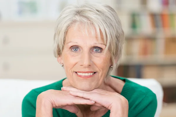 Thoughtful pensioner looking at the camera — Stock Photo, Image