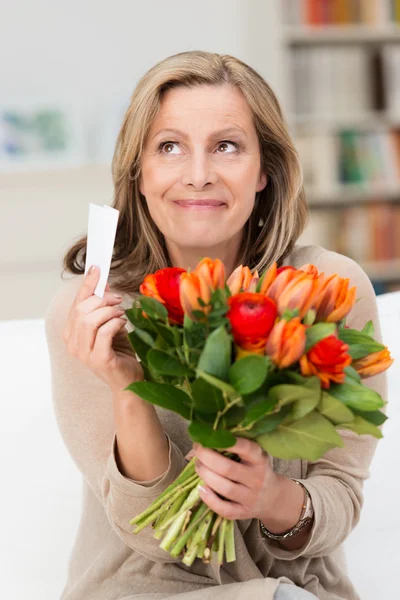 Happy beautiful woman sitting romanticising — Stock Photo, Image