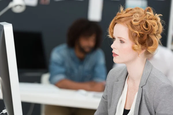 Beautiful engrossed young businesswoman — Stock Photo, Image