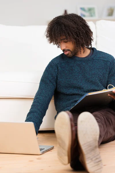 Young African American man studying at home — Stock Photo, Image