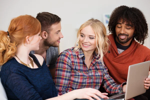 Group of multiethnic friends relaxing at home — Stock Photo, Image