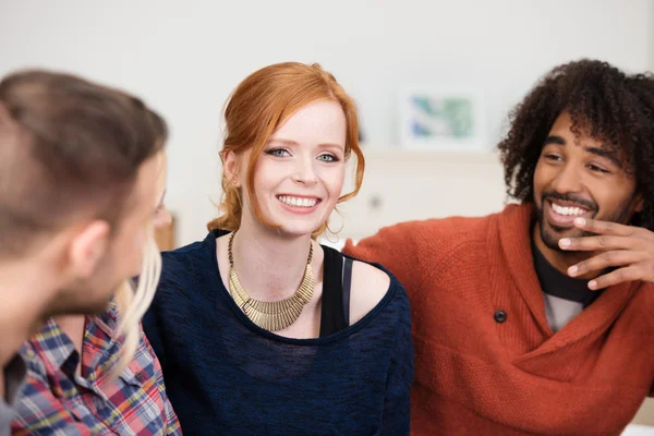 Beautiful redhead woman with two male friends — Stock Photo, Image