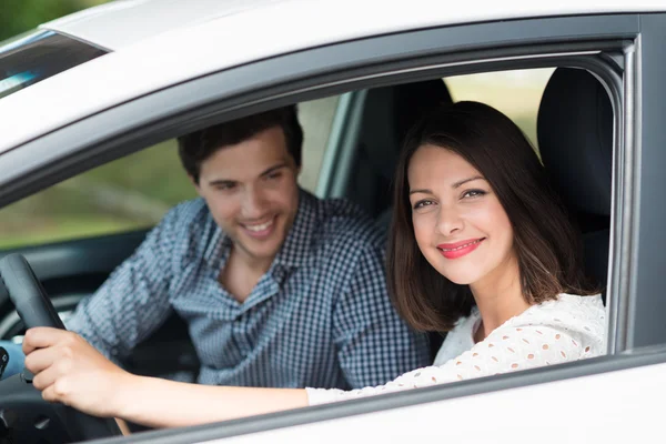 Woman taking her husband for drive — Stock Photo, Image