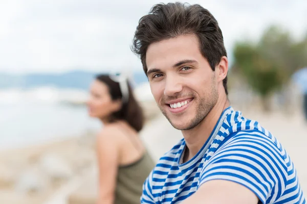 Young man relaxing at seaside — Stock Photo, Image