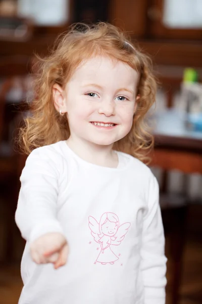Little girl pointing at camera — Stock Photo, Image