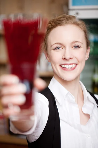 Woman toasting or serving beverage — Stock Photo, Image