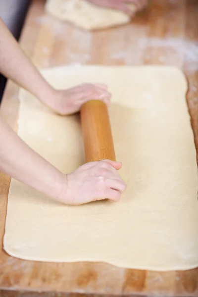 Chef rolling dough — Stock Photo, Image