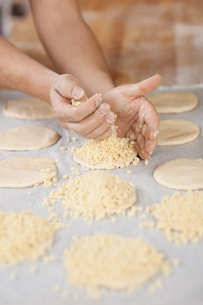 Chef at bakery preparing streuselteilchen — Stock Photo, Image