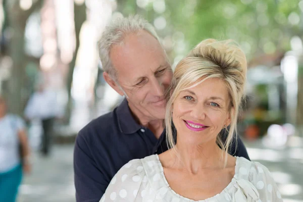 Mature couple in an intimate embrace — Stock Photo, Image