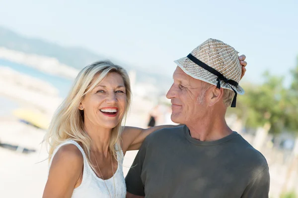 Woman placing hat on husbands head — Stock Photo, Image