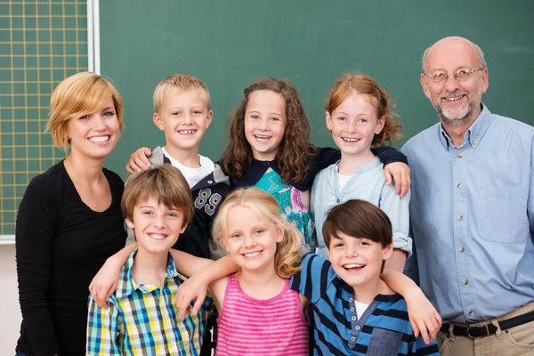 Students posing with their teachers — Stock Photo, Image