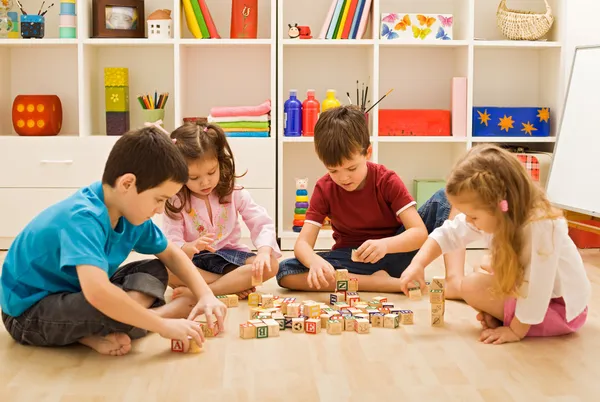 Children playing with blocks Stock Image
