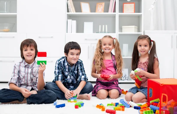 Children playing with blocks Stock Photo by ©mesike 24744099