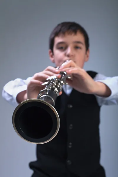 Boy playing on the clarinet — Stock Photo, Image