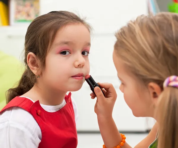 Applying lipstick Stock Picture