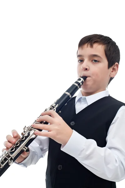 Boy playing on the clarinet Stock Photo