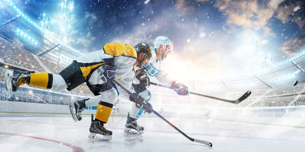 Hockey. Two professional hockey player in action. Fight for the puck. Sports emotions. Side view. Sport — Stock Photo, Image