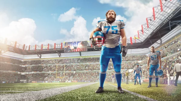 Ein American-Football-Spieler steht im Stadion und hält einen Helm in der Hand. Tagsüber Stadion. Freizeit — Stockfoto