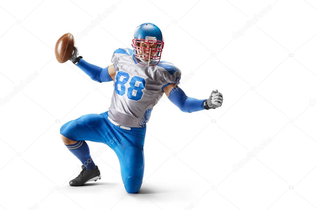 American football sportsman in action and motion. Sport. Standing on one knee on a white background. Sports emotions