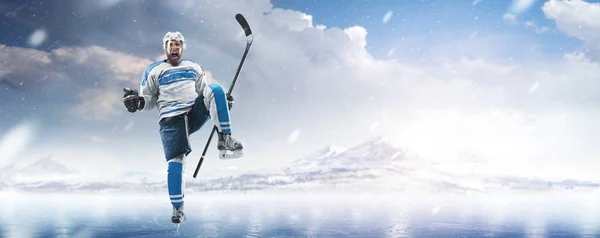 Athlete in action. Very emotional hockey player with stick and puck in his hands in ice. Sports emotions. Hockey athlete with desire to win and be champion. Sport