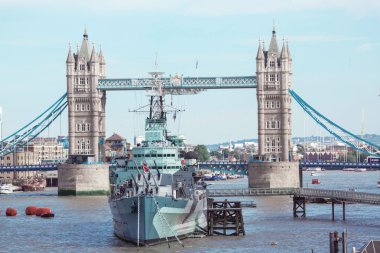 The Tower Bridge and the warship HMS Belfast. clipart