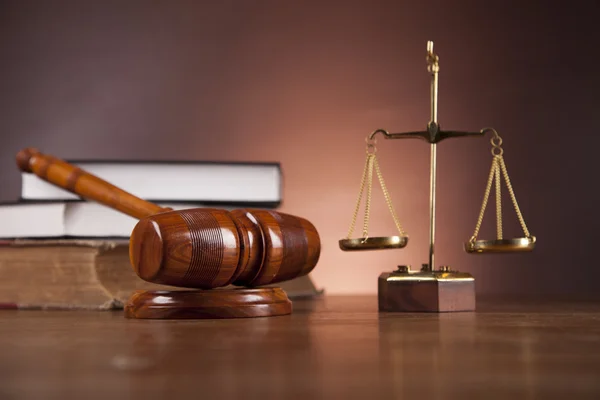 Law concept with wooden table and dark background — Stock Photo, Image