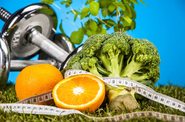 Fitness theme with fruits, blue background — Stock Photo, Image