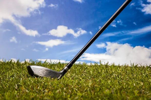 Green field with golf equipment — Stock Photo, Image