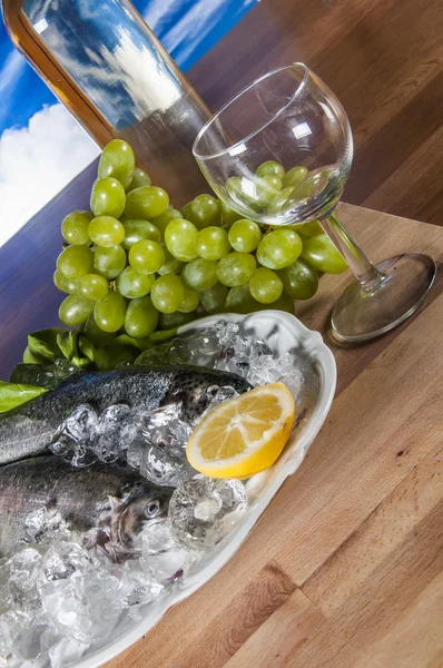 Raw fish on the plate and light background — Stock Photo, Image