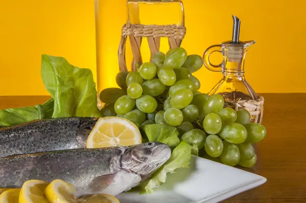 Raw fish on the plate and light background — Stock Photo, Image