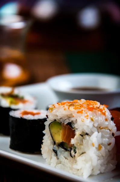 Japanese sushi on the old wooden table — Stock Photo, Image