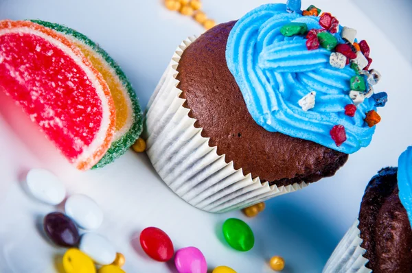 Home baked sweets on the bright, blue background — Stock Photo, Image