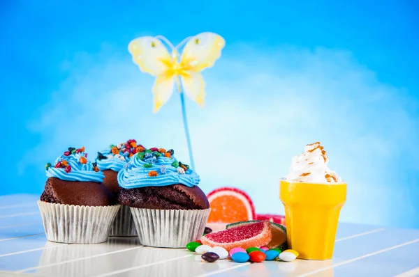 Colorful sweets, candy theme with muffins — Stock Photo, Image