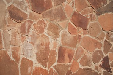 Tuğla parçacıkları ile desenli arka plan. Bir parça malzeme duvarı. Çatlak ve dikişli duvar.