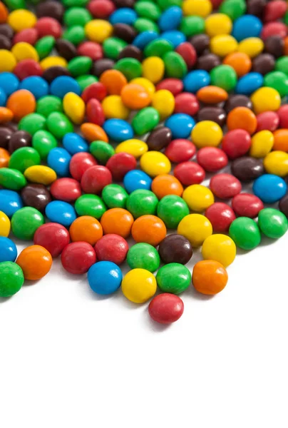 Χρωματιστά γλυκά σε λευκό φόντο — Φωτογραφία Αρχείου