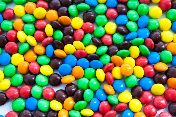 Багатокольорові цукерки як фон — стокове фото