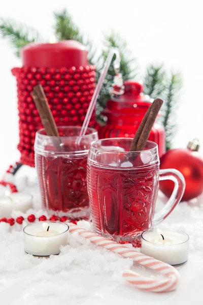 Two glasses of mulled wine and candle with Christmas decorations — Stock Photo, Image