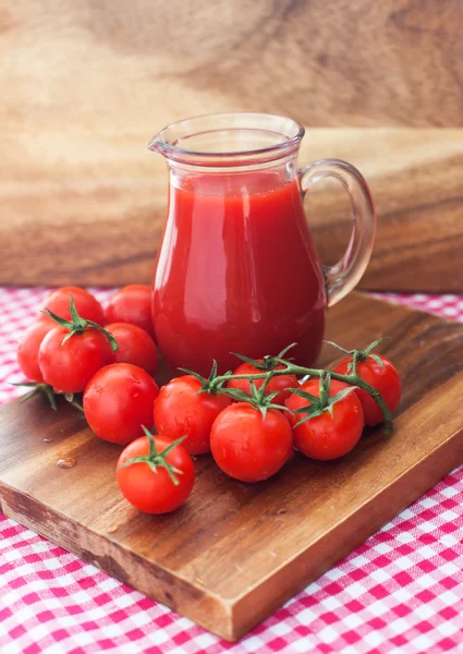 Tomato juice in glass jug — Stock Photo, Image