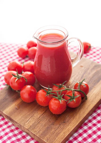 Tomato juice in glass jug — Stock Photo, Image