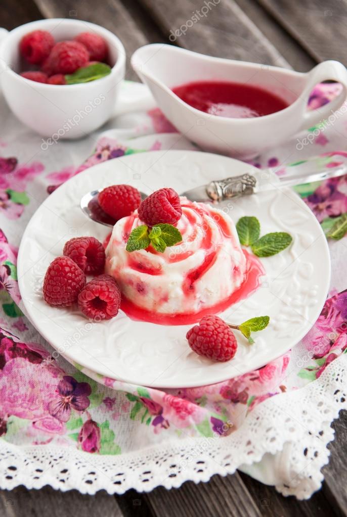 Delicious dessert with raspberry sauce and fresh berries 
