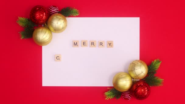 Merry Christmas Text Appear White Paper Surrounded Christmas Ornaments Stop — Stock Video