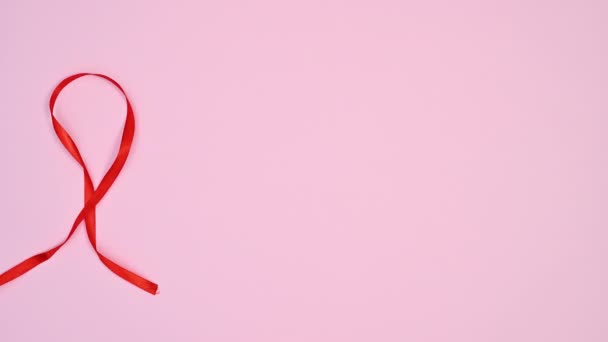 Красная Лента Сделать Сердце Левой Стороне Пастельно Розовой Темы Стоп — стоковое видео