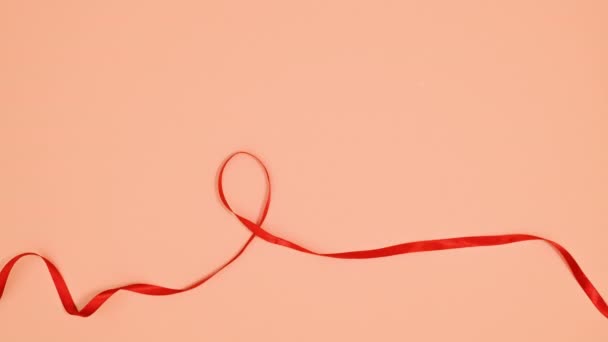 Ruban Rouge Faire Coeur Sur Thème Orange Stop Motion — Video