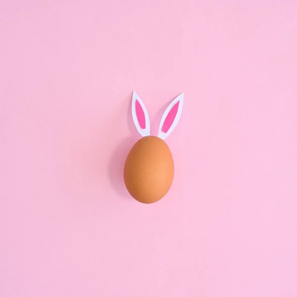 One Natural Egg Rabbit Ears Bright Pastel Pink Background Flat — Stock Photo, Image