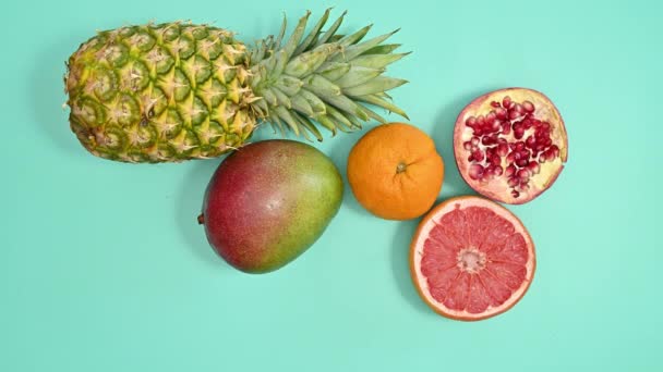 Topical Summer Fruits Appear Cyan Background Flat Lay Stop Motion — Vídeo de Stock